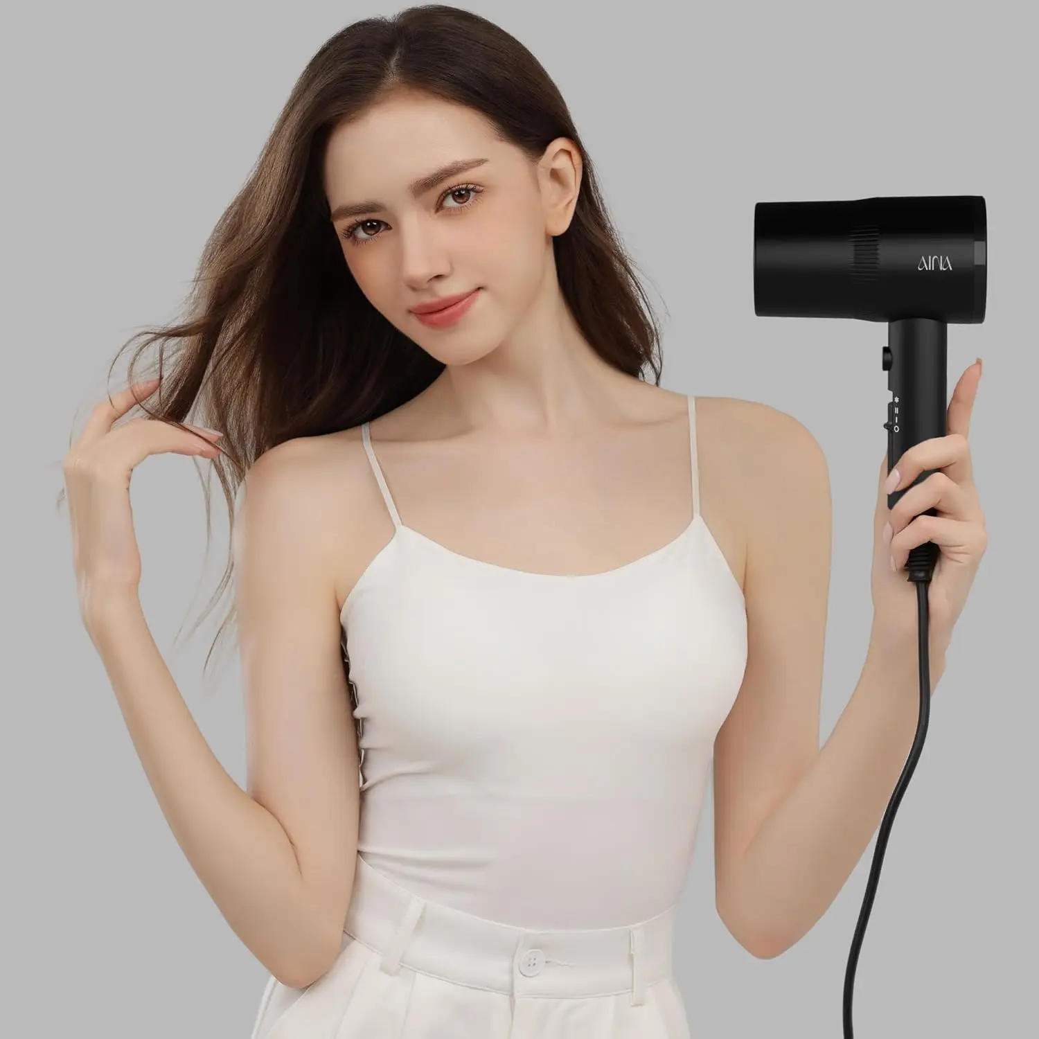 AINA hair dryer with diffuser attachment, featuring ionic and ceramic technology for fast drying and shiny, frizz-free hair.