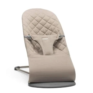 Sand grey baby bouncer gently rocks a baby, providing ergonomic support and promoting sensory development from newborn to toddler age.