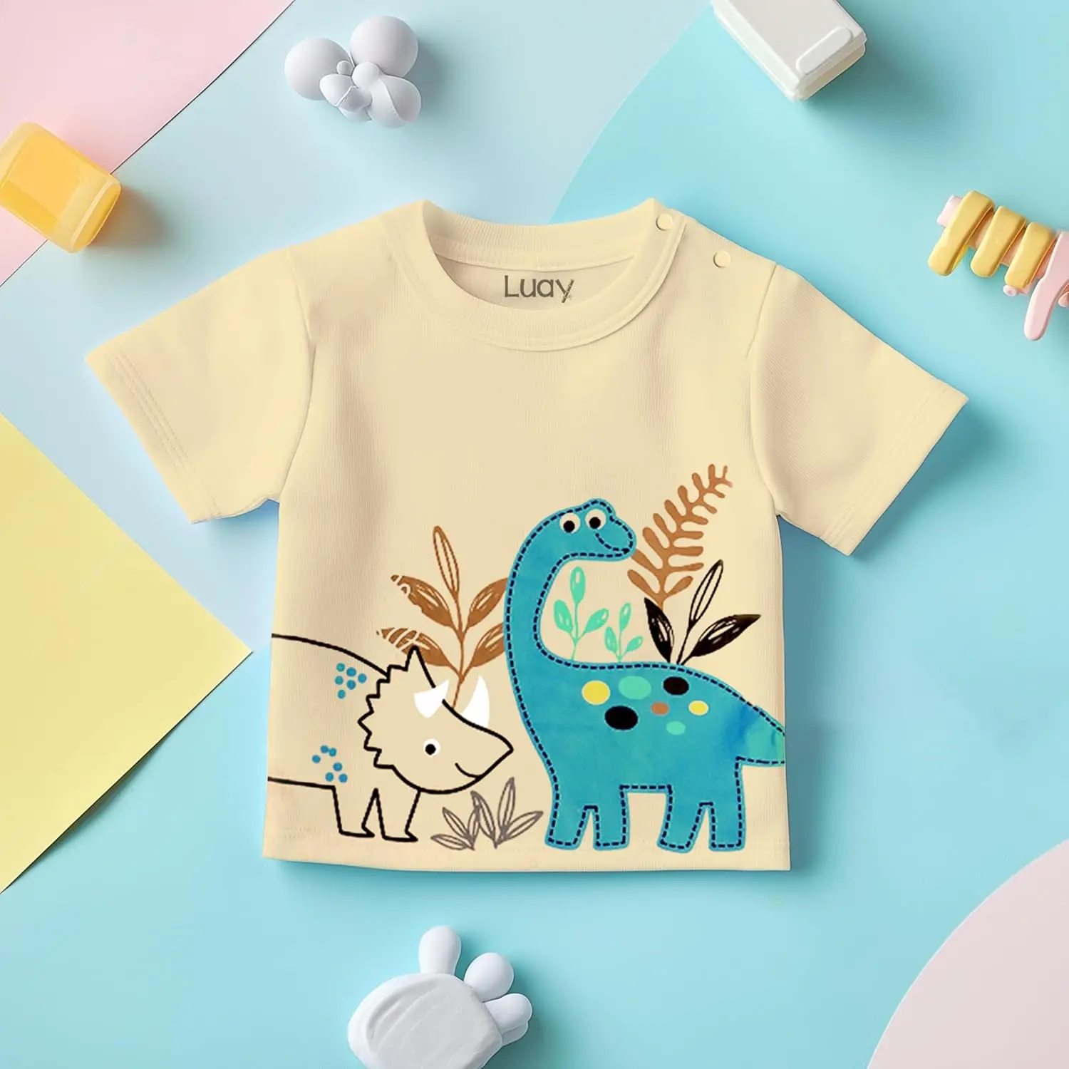 Adorable and practical LUAY baby clothes set featuring a playful design with colorful symbols on a soft, machine-washable cotton blend, perfect for gifting.