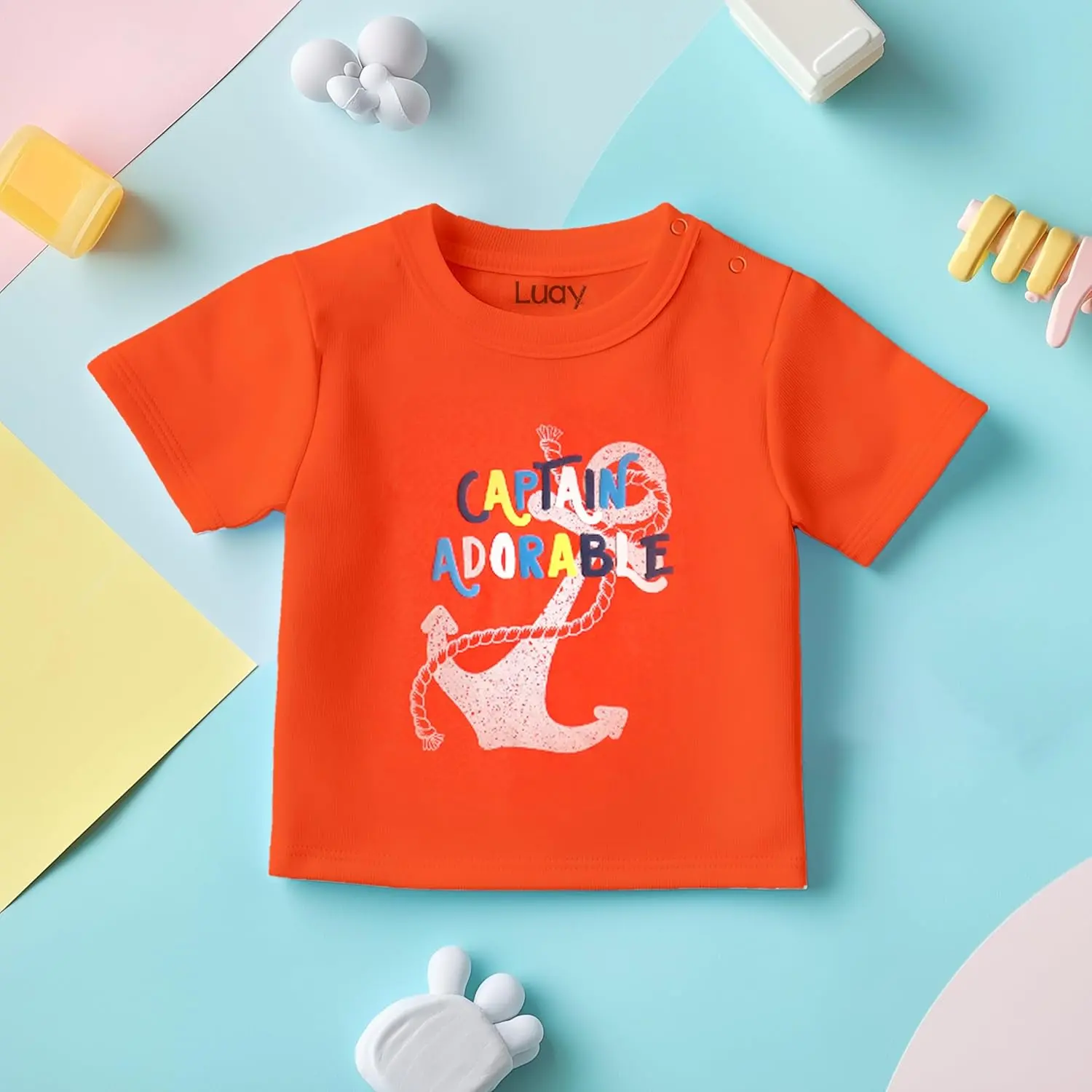Adorable and practical LUAY baby clothes set featuring a playful design with colorful symbols on a soft, machine-washable cotton blend, perfect for gifting.