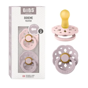 A two-pack of Bibs Boheme pacifiers in blossom and dusky lilac colors, made with a soft, round, natural rubber nipple and a gently curved shield designed to prevent skin irritation.