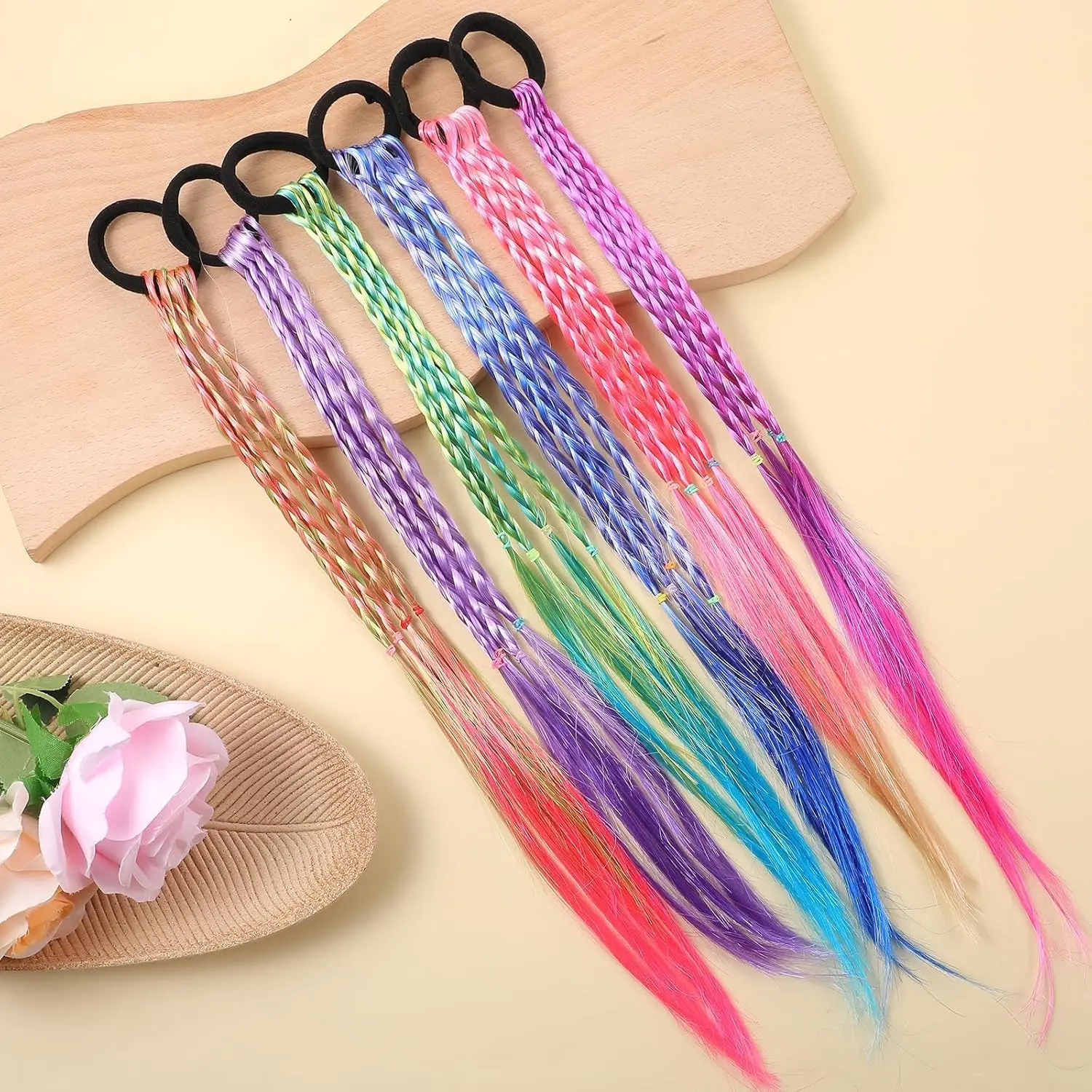 Set of 12 colorful braided hair extensions with elastic bands, perfect for adding a playful touch to kids' ponytails and cosplay hairstyles.