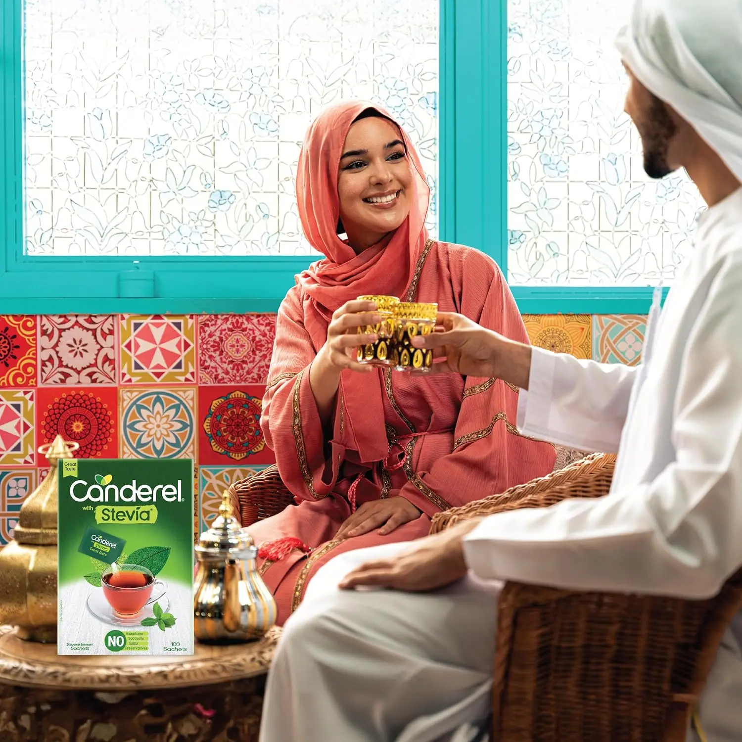 This image displays a pack of Canderel Stevia Sweetener Sachets, offering a sugar-free alternative for sweetening beverages like coffee and tea with zero calories and suitable for diabetics.