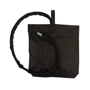 Discreet black urine catheter bag cover with a snap on pipe cover and hanging strap provides easy access and secure concealment for men and women.