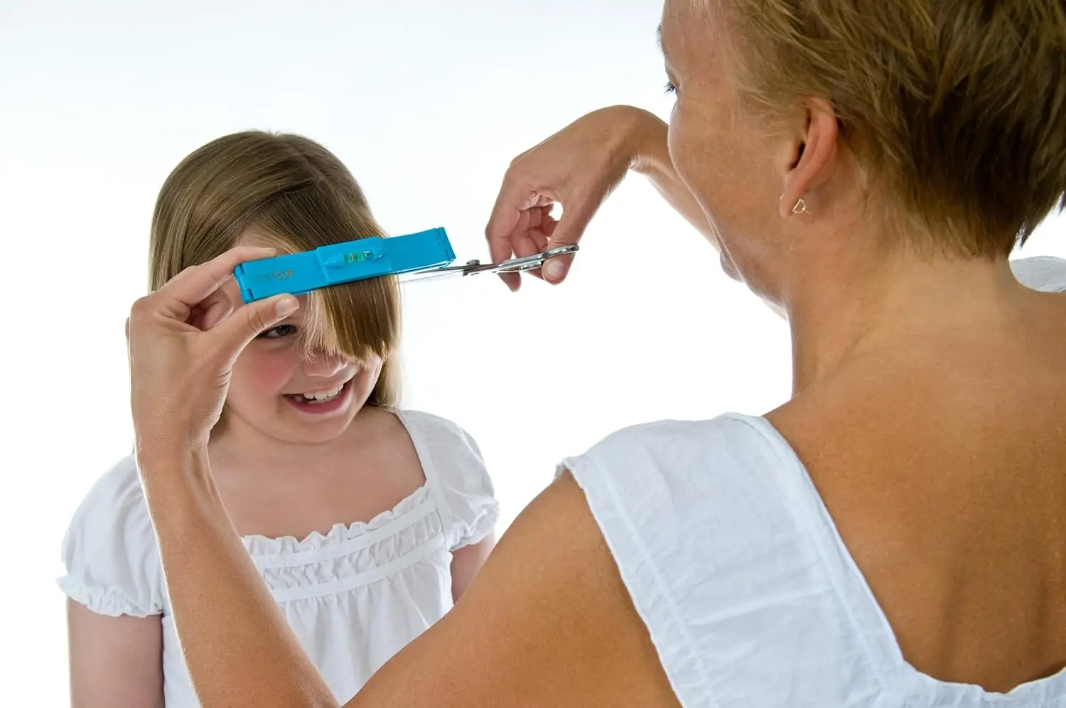 This image shows the CreaClip set and scissors by CreaProducts, a DIY hair cutting tool for styling layers, bangs, bobs and trims at home.