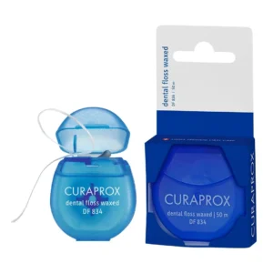 Curaprox waxed dental floss with refreshing mint flavor gently removes plaque from between teeth for healthy gums, dispensed from a hygienic container.