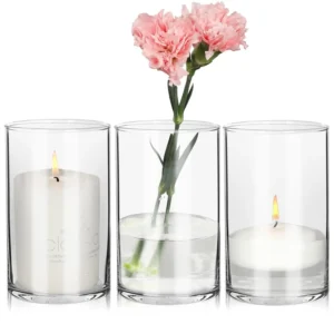 This set of three 6 inch tall clear glass cylinder vases is perfect for wedding centerpieces, floral arrangements, candle holders, or home decor.
