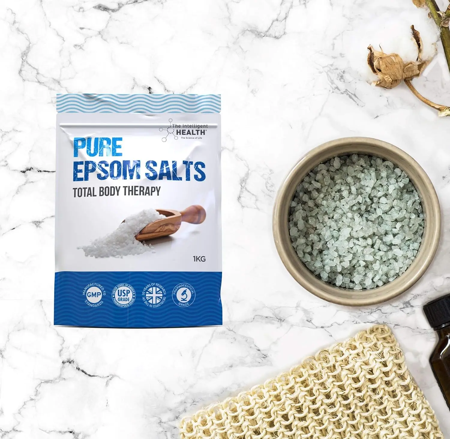 A kilogram bag of Intelligent Health Epsom Salts, a pure magnesium sulphate bath soak designed to help relieve muscle tension and promote relaxation for total body therapy.