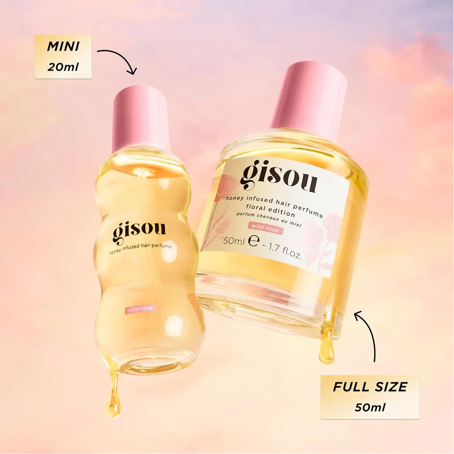 A small bottle of Gisou Honey Infused Hair Perfume in Wild Rose scent, designed to refresh and delicately scent hair with argan oil.