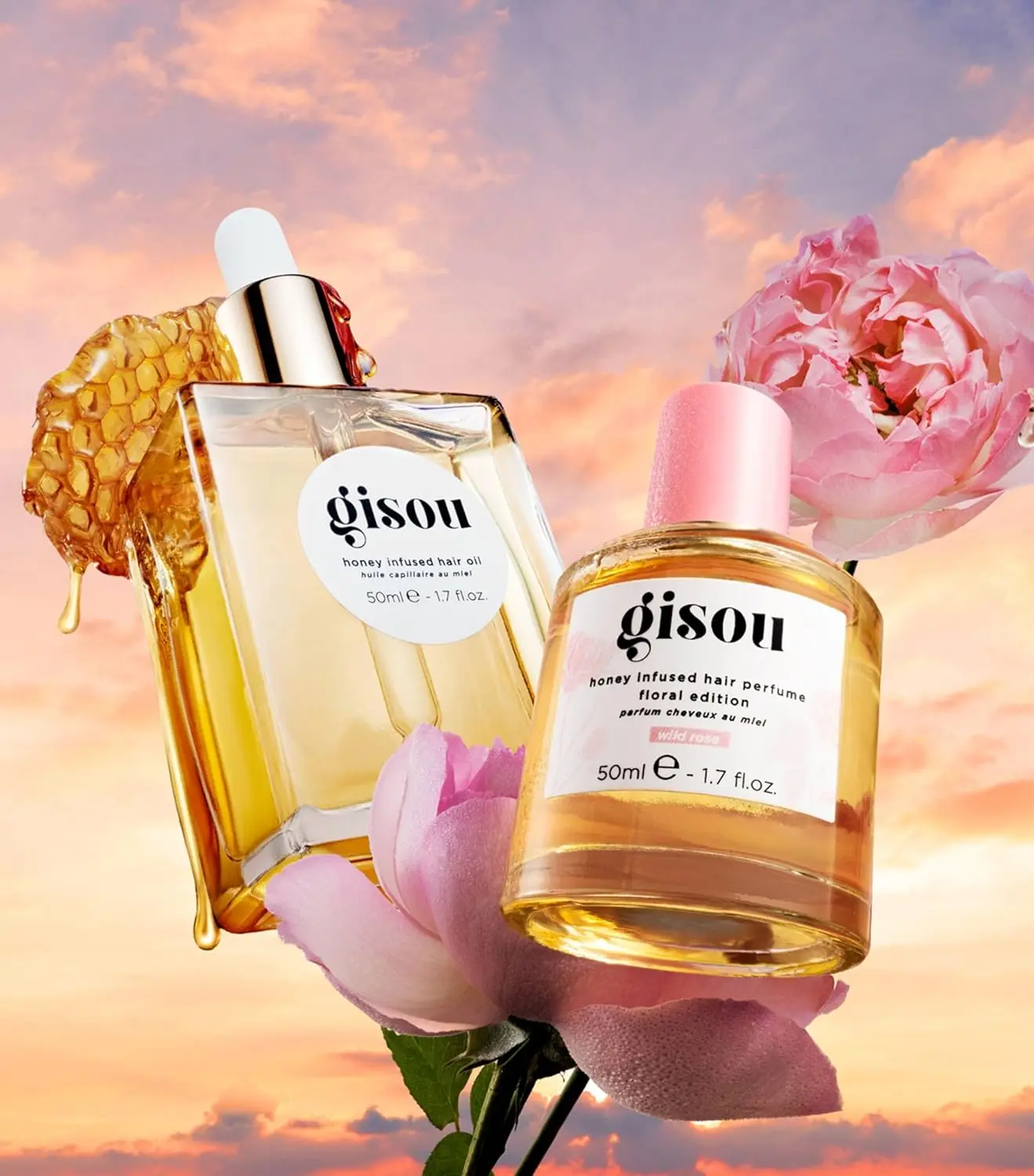 A bottle of GISOU Wild Rose Hair Perfume infused with honey, offering UV protection and a refreshing, garden-inspired fragrance.