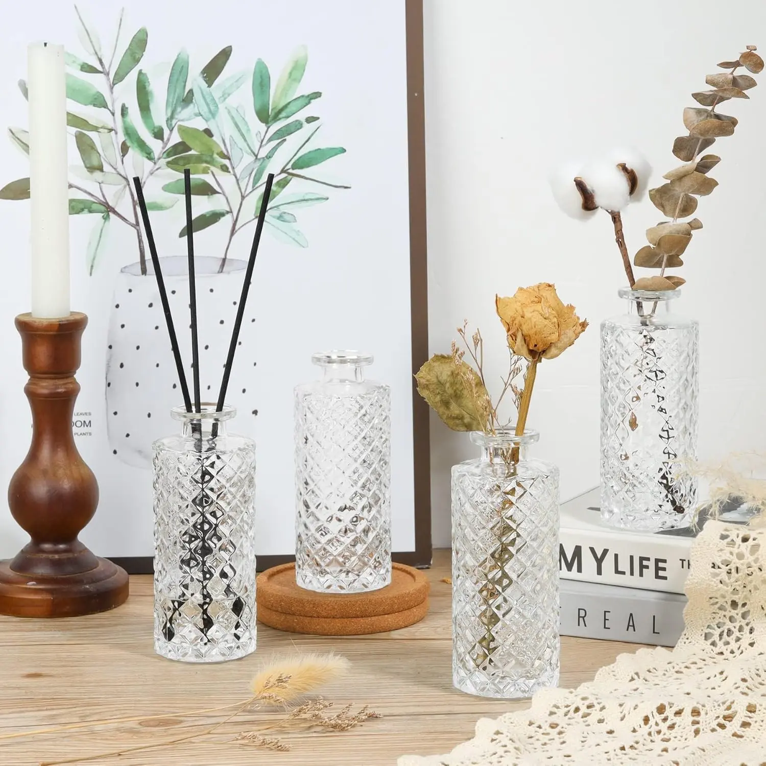 Set of six small, clear glass bud vases with a diamond pattern, perfect for displaying single flowers or creating elegant centerpieces.