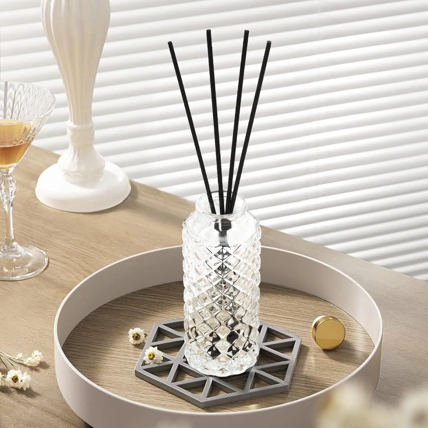 Set of six small, clear glass bud vases with a diamond pattern, perfect for displaying single flowers or creating elegant centerpieces.