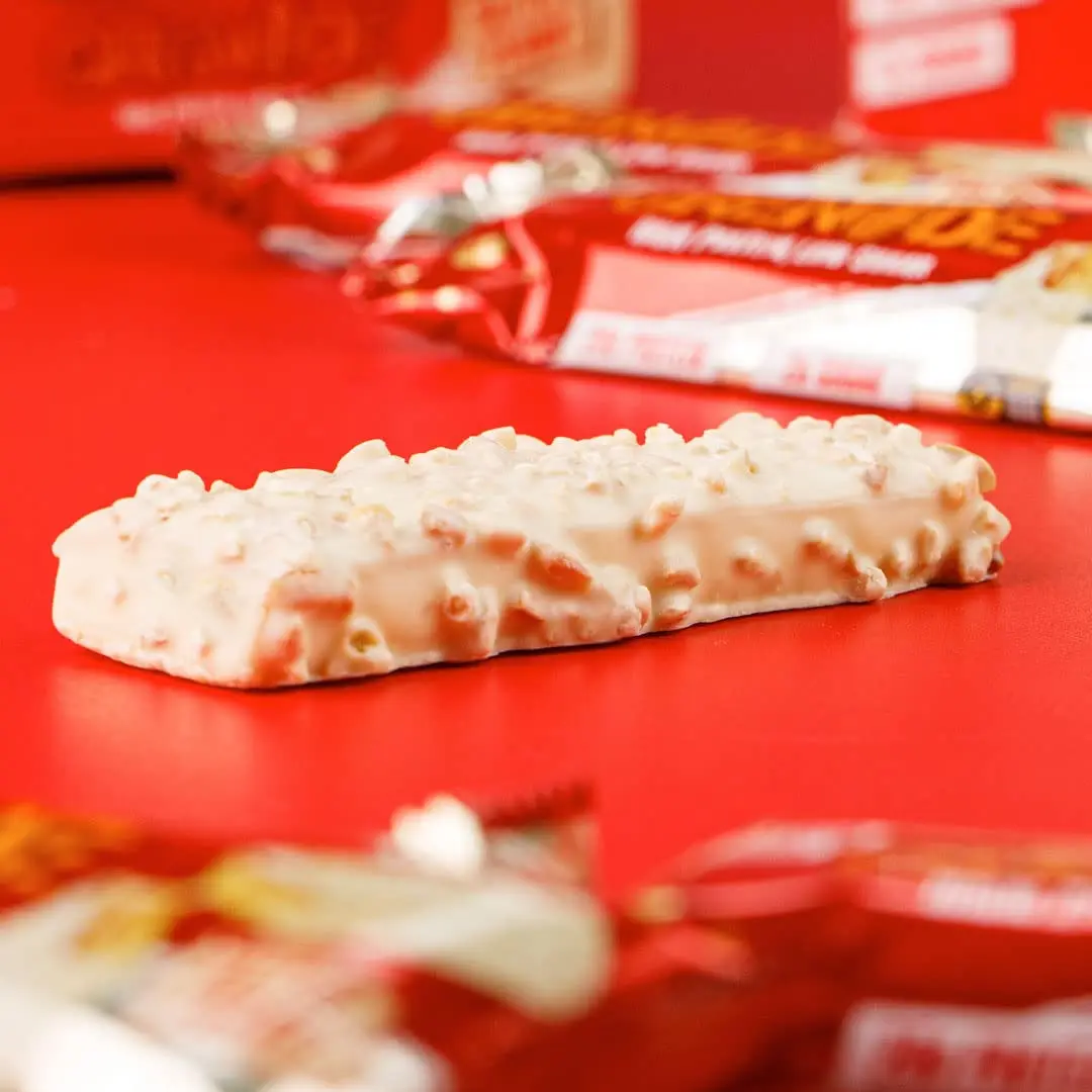 A box of Grenade White Chocolate Salted Peanut protein bars, a low sugar, low carb snack with 20g of protein.