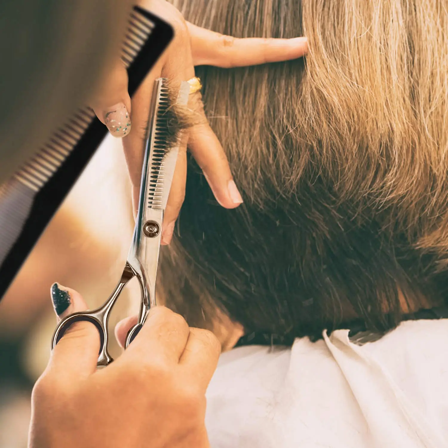 This 7-piece professional hair cutting kit includes sharp stainless steel barber shears, thinning shears, and accessories in a leather case for styling men, women, and pets.