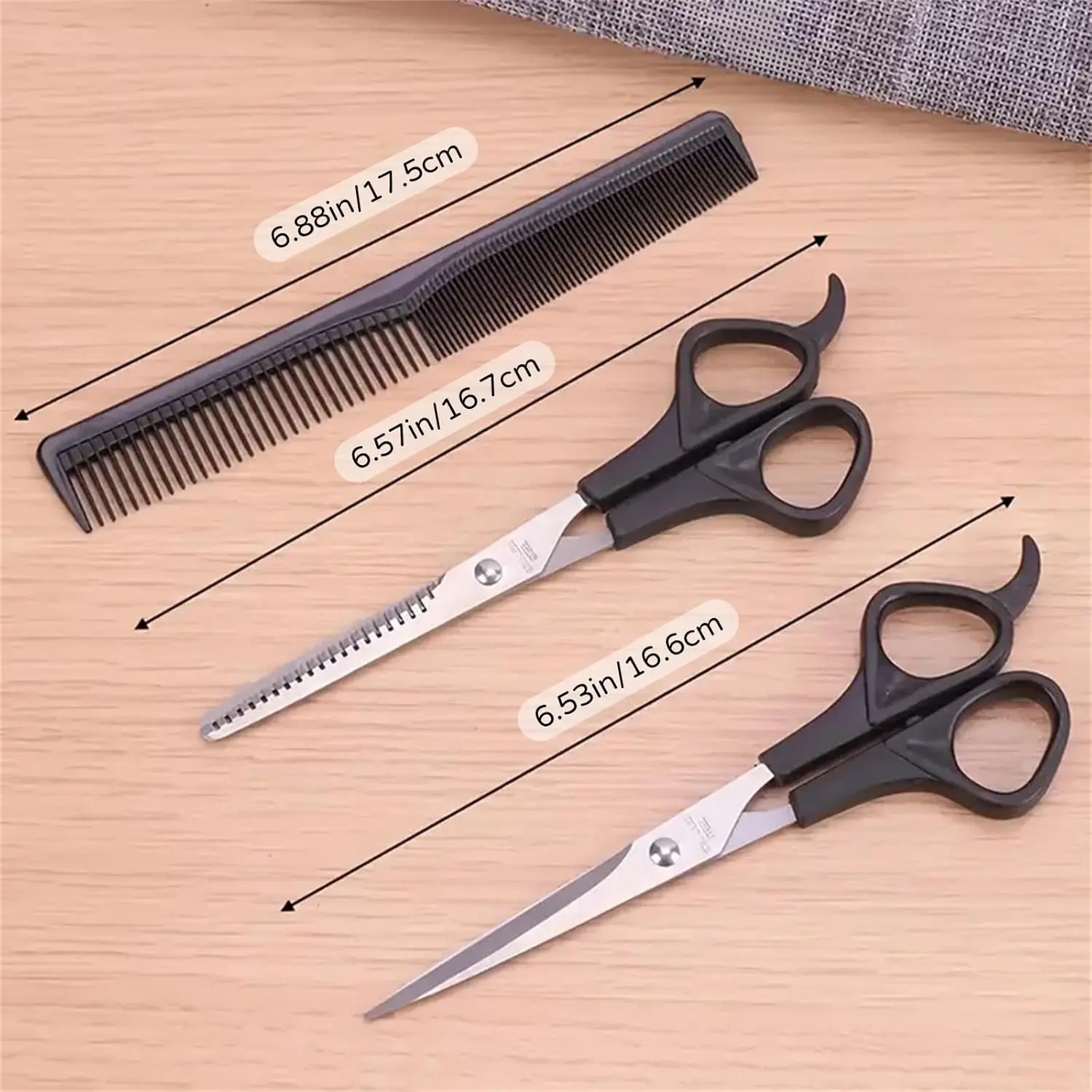 This three-piece stainless steel hair cutting set includes shears, thinning scissors, and a comb for professional or home use on men, women, and pets.