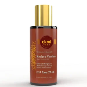 Ayurvedic hair growth oil infused with rosemary, castor, and bhringraj in a bottle, designed to promote hair density and prevent hair loss for both women and men.