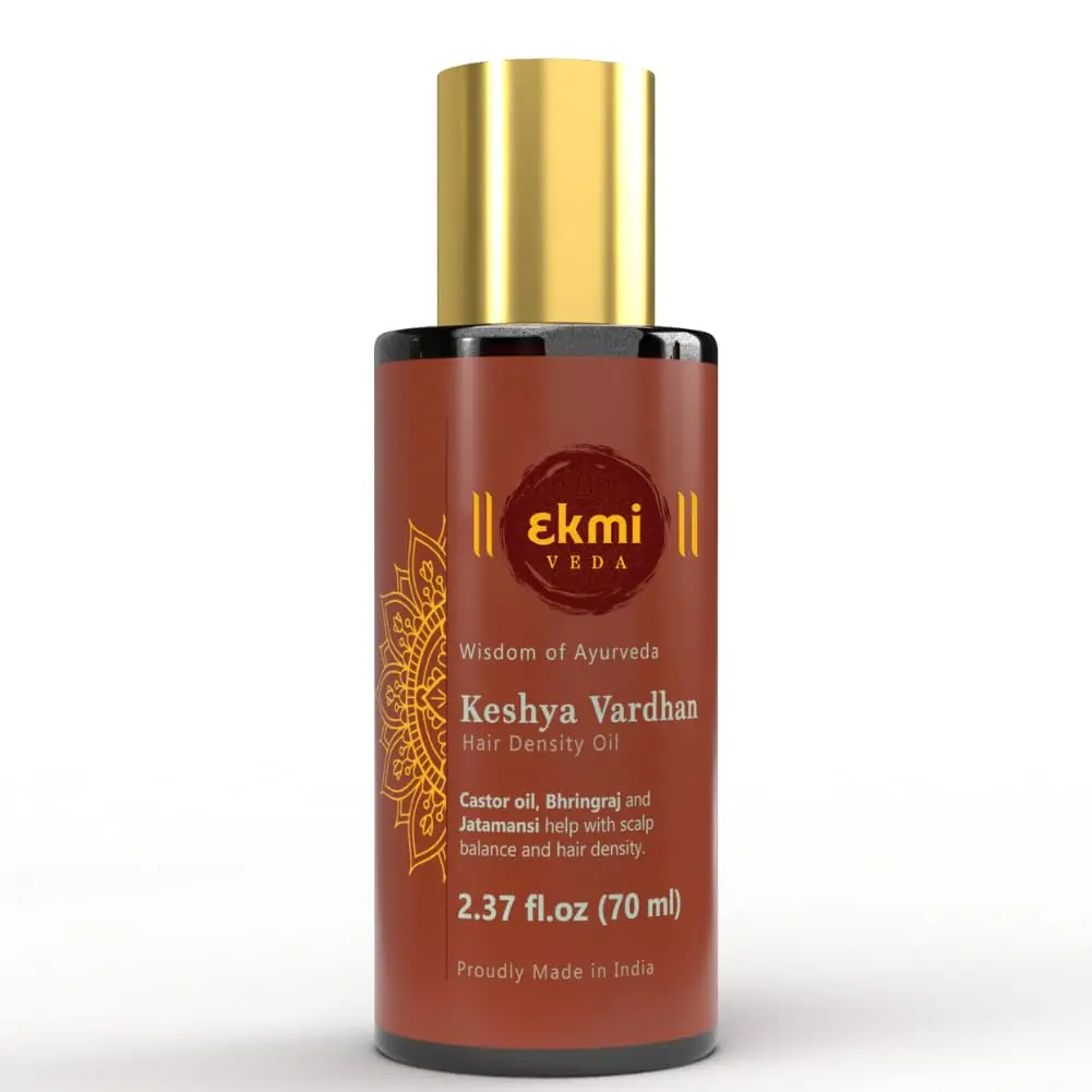 Ayurvedic hair growth oil infused with rosemary, castor, and bhringraj in a bottle, designed to promote hair density and prevent hair loss for both women and men.