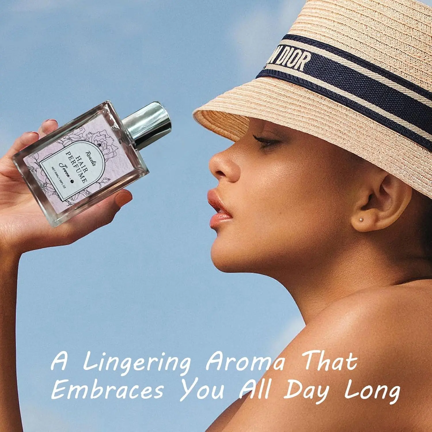 A bottle of hair perfume for women with sweet rose scent, featuring castor oil and vitamin E, designed to hydrate and nourish hair while leaving a long-lasting floral fragrance.