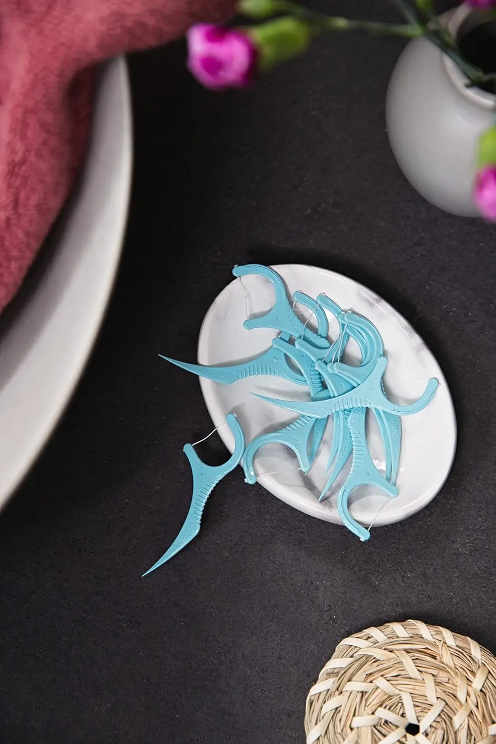 Jordan 3-in-1 dental flossers with toothpick and tongue scraper, made with 50% recycled plastic, effectively remove plaque for a fresh, beautiful smile.