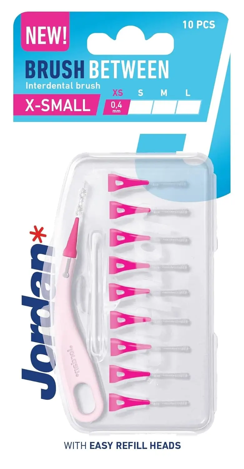 This is a pack of Jordan Brush Between interdental brushes, size extra small 0.4mm, featuring refillable heads, an ergonomic handle, and a travel case for cleaning between teeth.