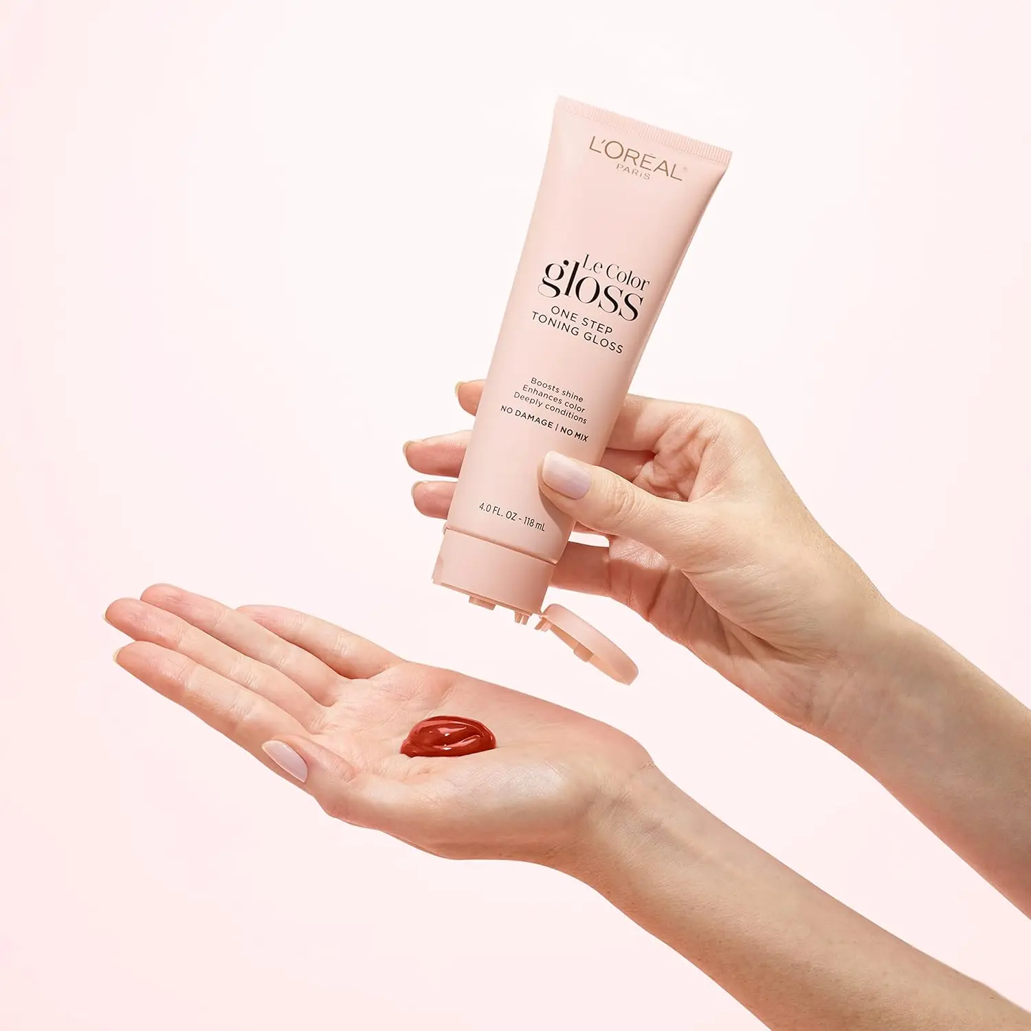 L'Oreal Paris auburn toning hair gloss enhances red tones, boosts shine, and deeply conditions for healthy, vibrant red or brown hair.