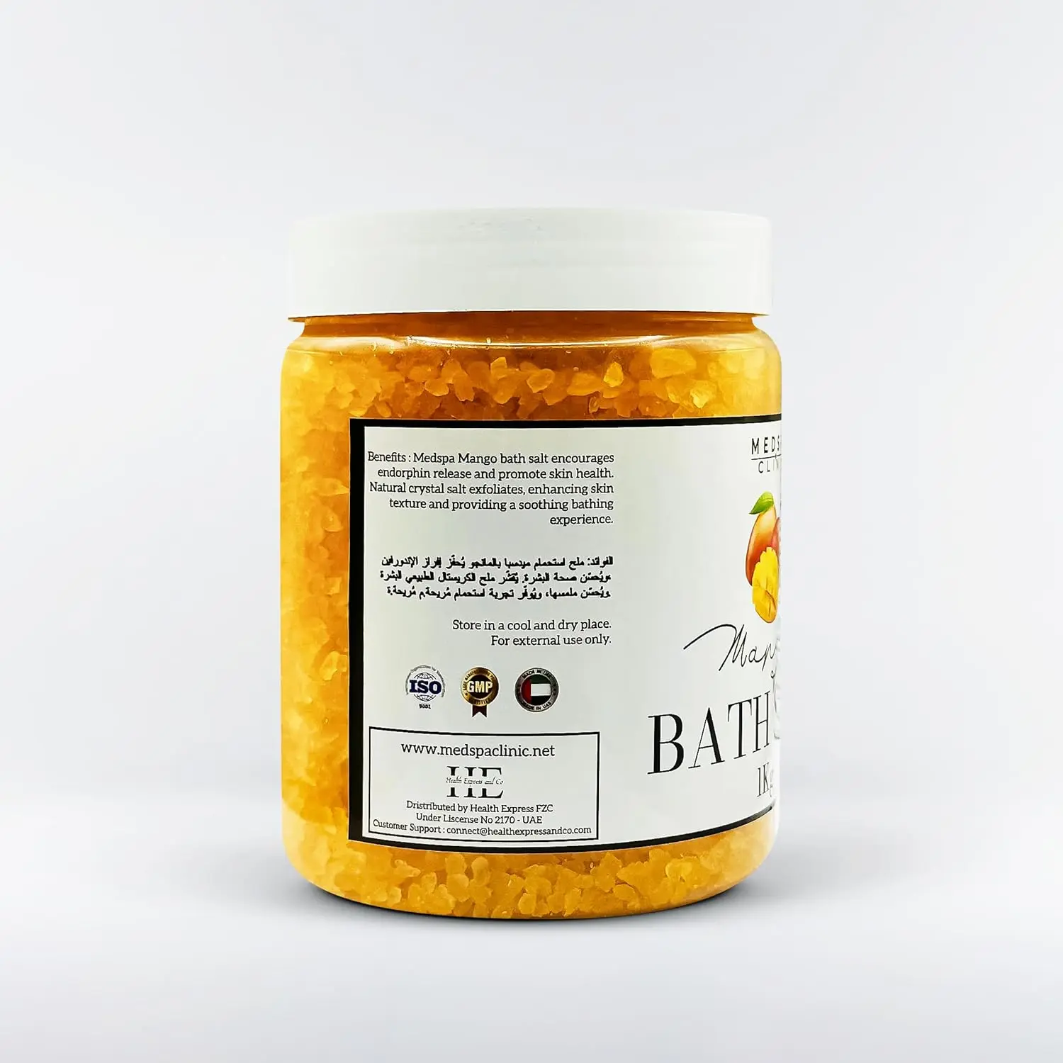 Close-up of fragrant mango bath salt crystals dissolving in warm water, creating a relaxing and aromatic spa experience for full body and foot soaks.