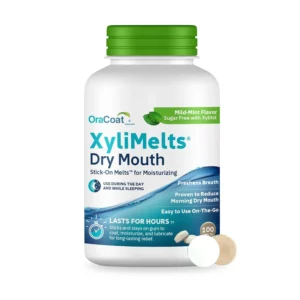 Close-up of OraCoat XyliMelts oral adhering discs for dry mouth relief, featuring a mild mint flavor and xylitol, designed to stimulate saliva production for both day and night use.