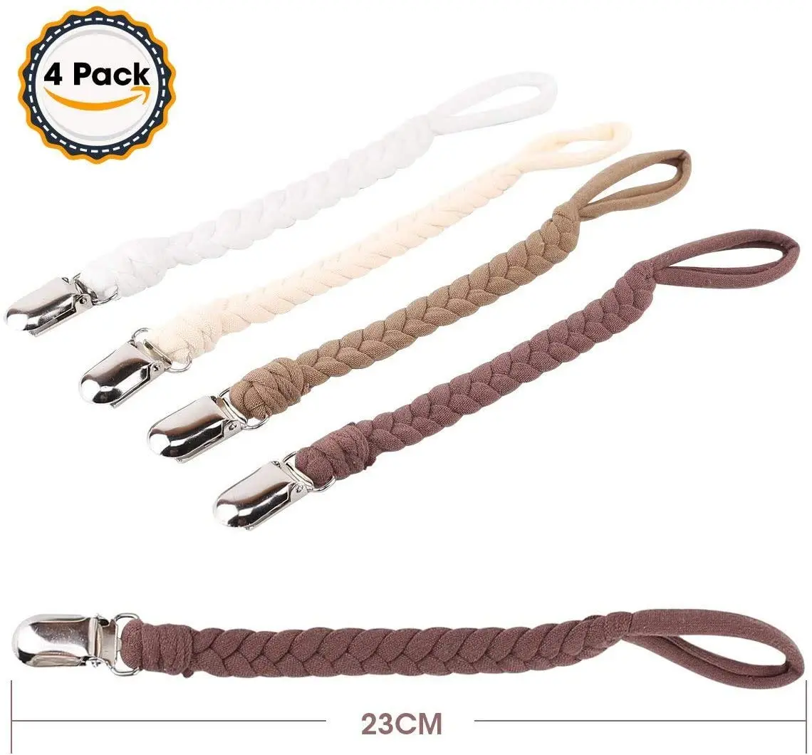 Four colorful pacifier clips securely attached to baby clothes, keeping pacifiers clean and within reach for boys and girls.