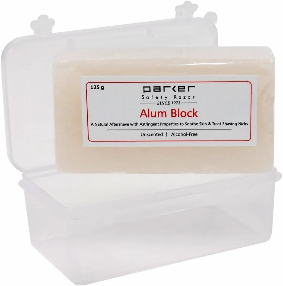 Parker Safety Razor's 125G alum block is a natural antiseptic aftershave treatment that tightens pores and treats minor cuts, packaged in a convenient travel case.
