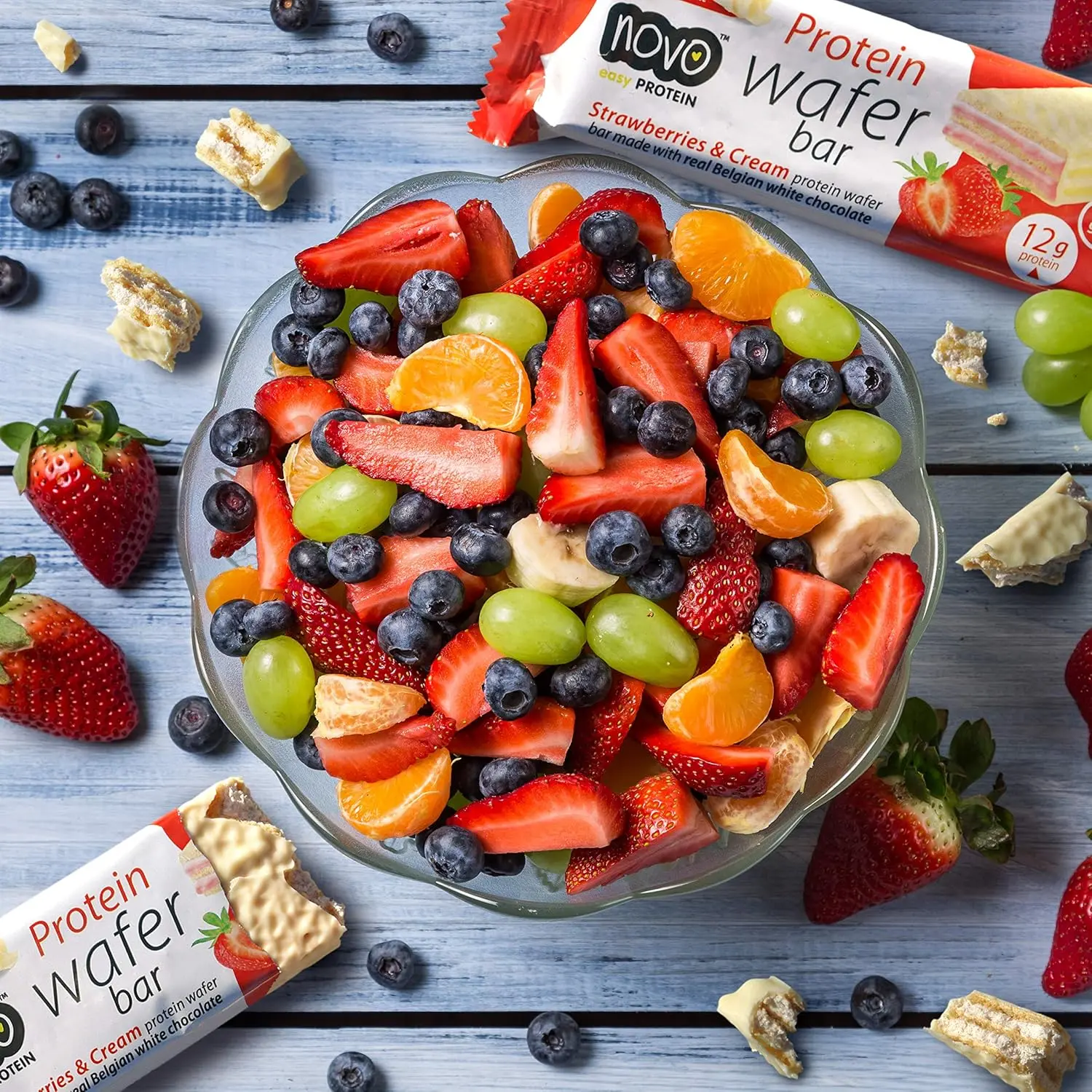 Novo protein wafer bar with strawberries and cream flavor covered in real Belgian chocolate, providing 13g of protein per serving.