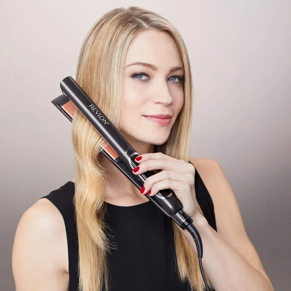 Revlon hair straightener with copper ceramic plates for smooth glide and shiny, professional styling up to 235 degrees Celsius.