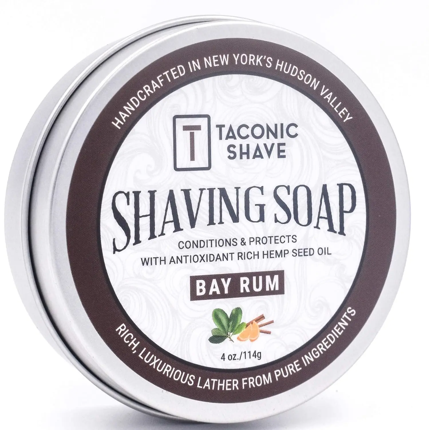 Taconic Shave Bay Rum shaving soap puck with warm, spiced aroma provides a thick and slick lather for a classic wet shave experience.