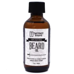 Taconic Shave Excalibur beard oil in a glass bottle with drip dispenser provides unmatched beard and skin conditioning with a classic musk and woods scent.