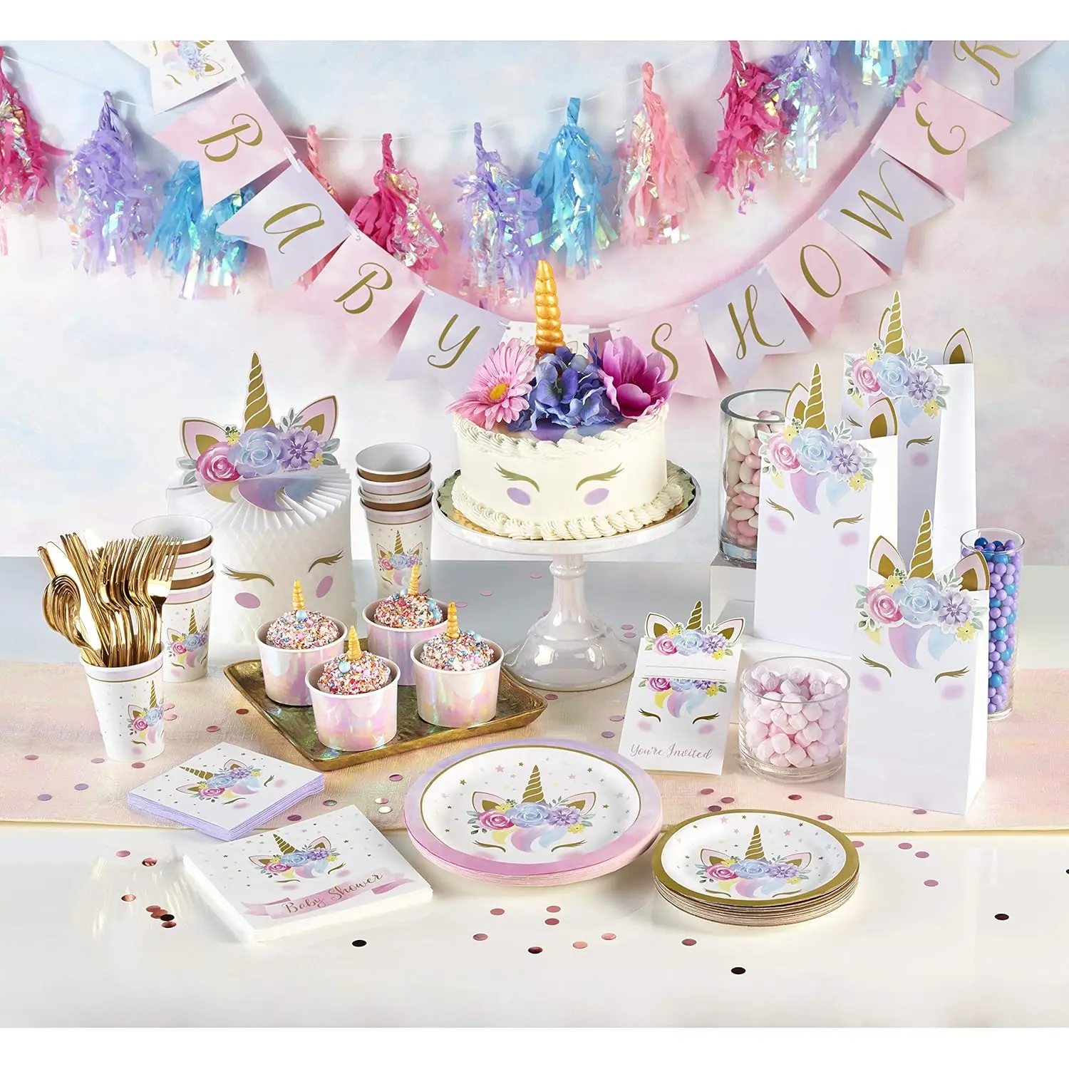 A pack of 16 floral unicorn baby shower napkins, featuring a dreamy unicorn character and soft pastel gold accents.