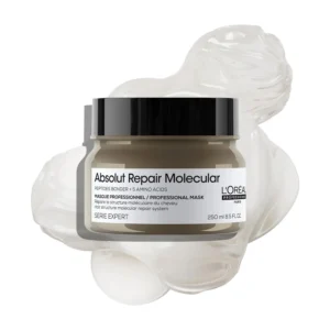 L'Oréal Professionnel Absolut Repair Molecular Mask rebuilds damaged hair at a molecular level with peptides and amino acids, restoring strength, detangling, and adding suppleness, as shown in this image of the Serie Expert rinse-off mask.