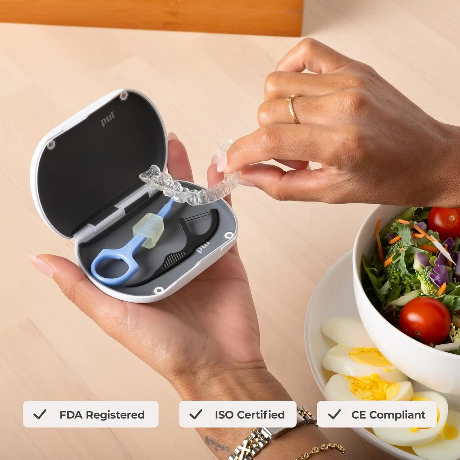 Gray slim and sleek PUL aligner case securely holding clear aligners.