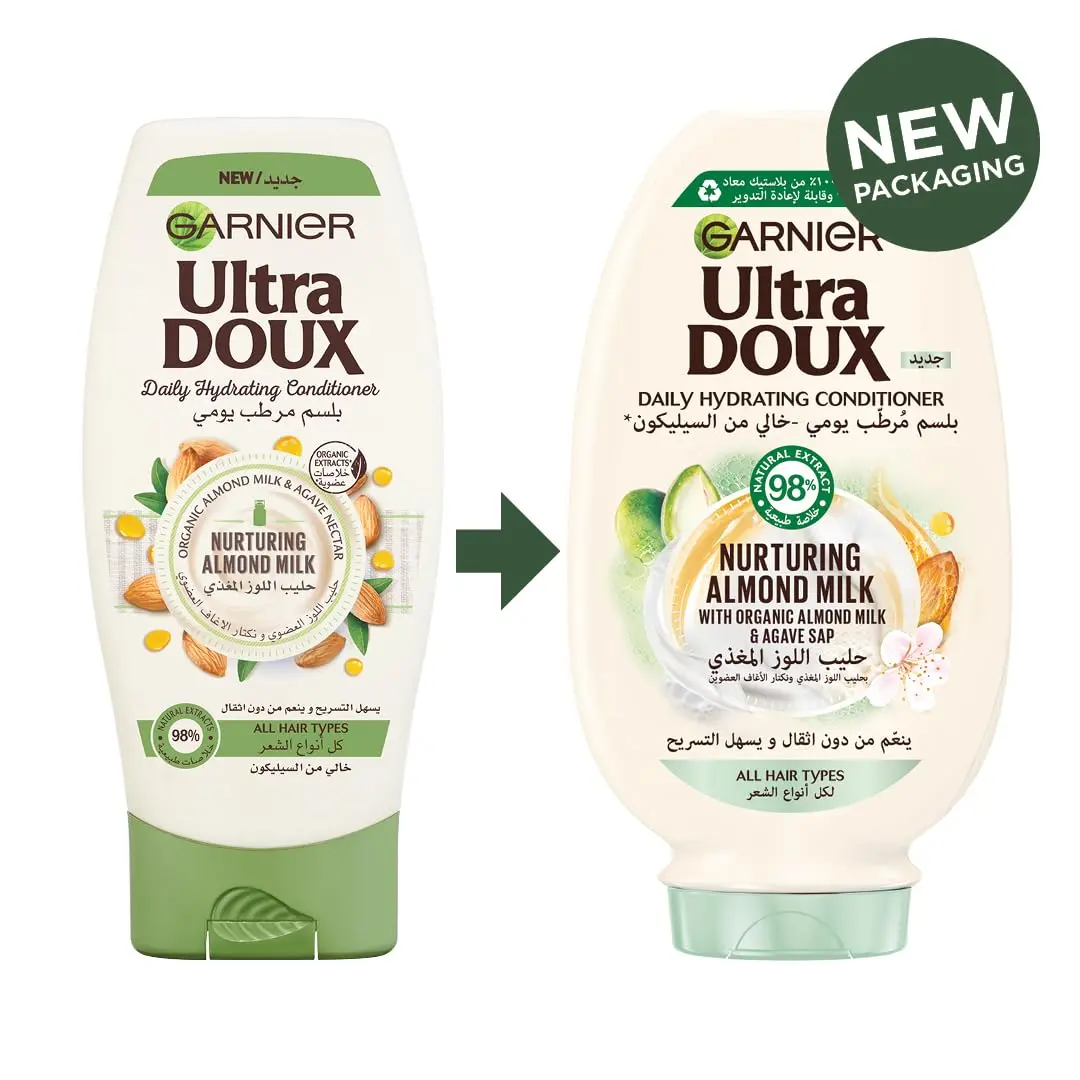 Garnier Ultra Doux almond milk shampoo and conditioner set, designed to hydrate and nurture all hair types without weighing them down, formulated with organic ingredients.