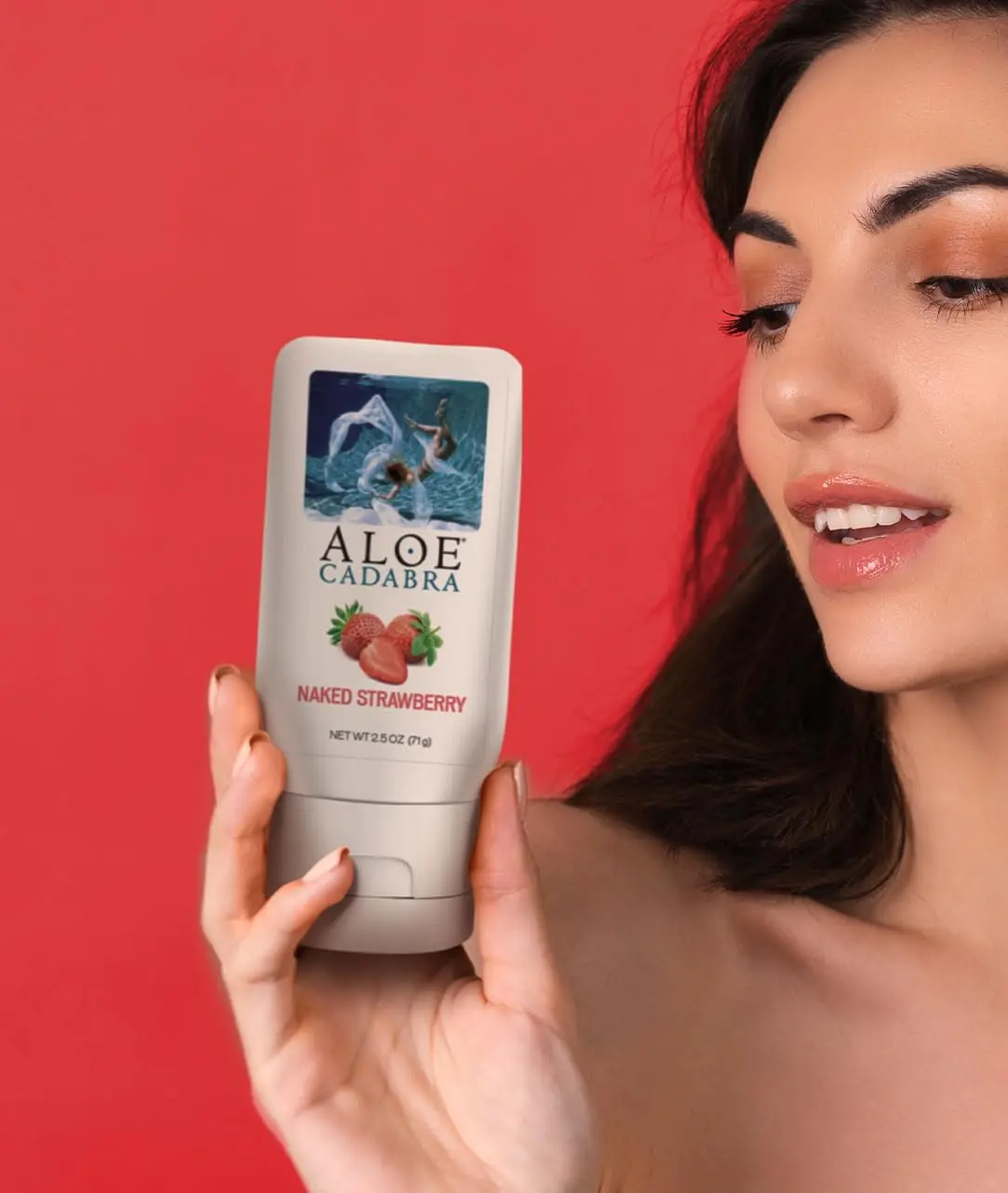 A bottle of Aloe Cadabra body lubricant, formulated with care and well packed, is displayed.