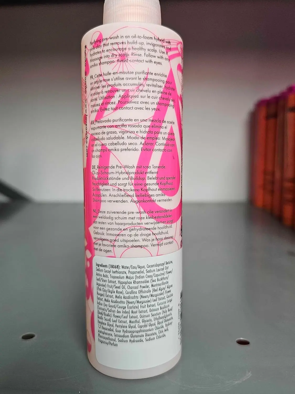 Amika Reset pink charcoal cleansing oil transforms into a foam to purify and detoxify the scalp, removing build-up, dirt, and oil for a refreshed feel.