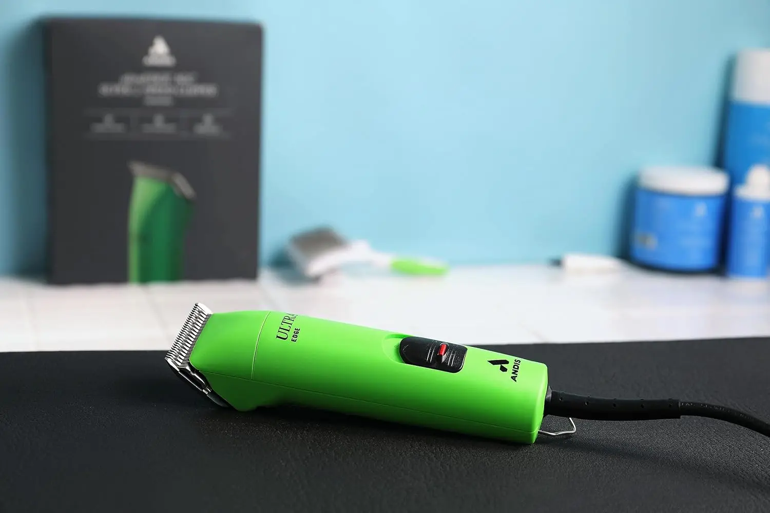 The Andis UltraEdge Super 2-Speed clipper in spring green quickly and quietly trims thick dog hair with its sharp, detachable blade.