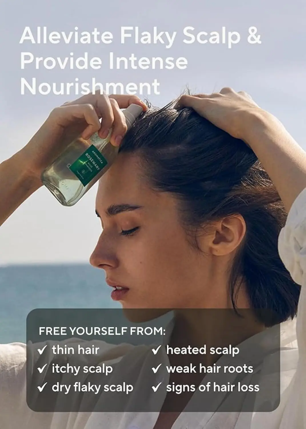 A bottle of AROMATICA Rosemary Root Enhancer scalp spray designed to revitalize the scalp and strengthen hair with salicylic acid.