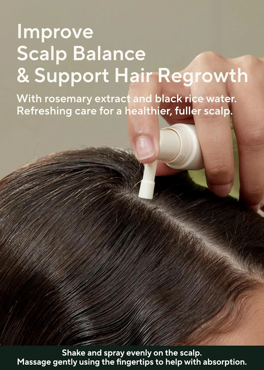 A bottle of AROMATICA Rosemary Root Enhancer scalp spray designed to revitalize the scalp and strengthen hair with salicylic acid.