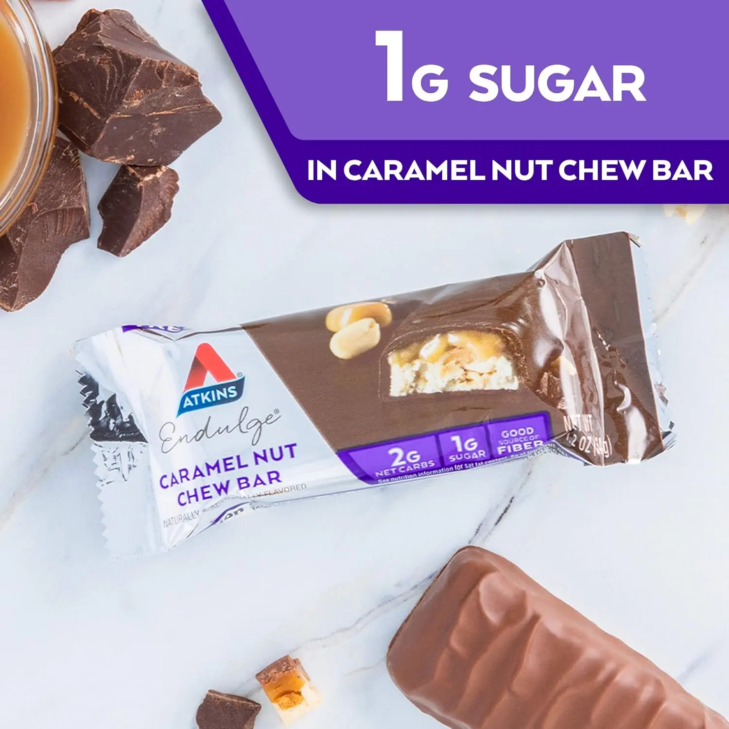 One Atkins Endulge Caramel Nut Chew bar featuring peanuts, nougat, a caramel layer, and chocolate coating, with 6 grams of fiber per serving.