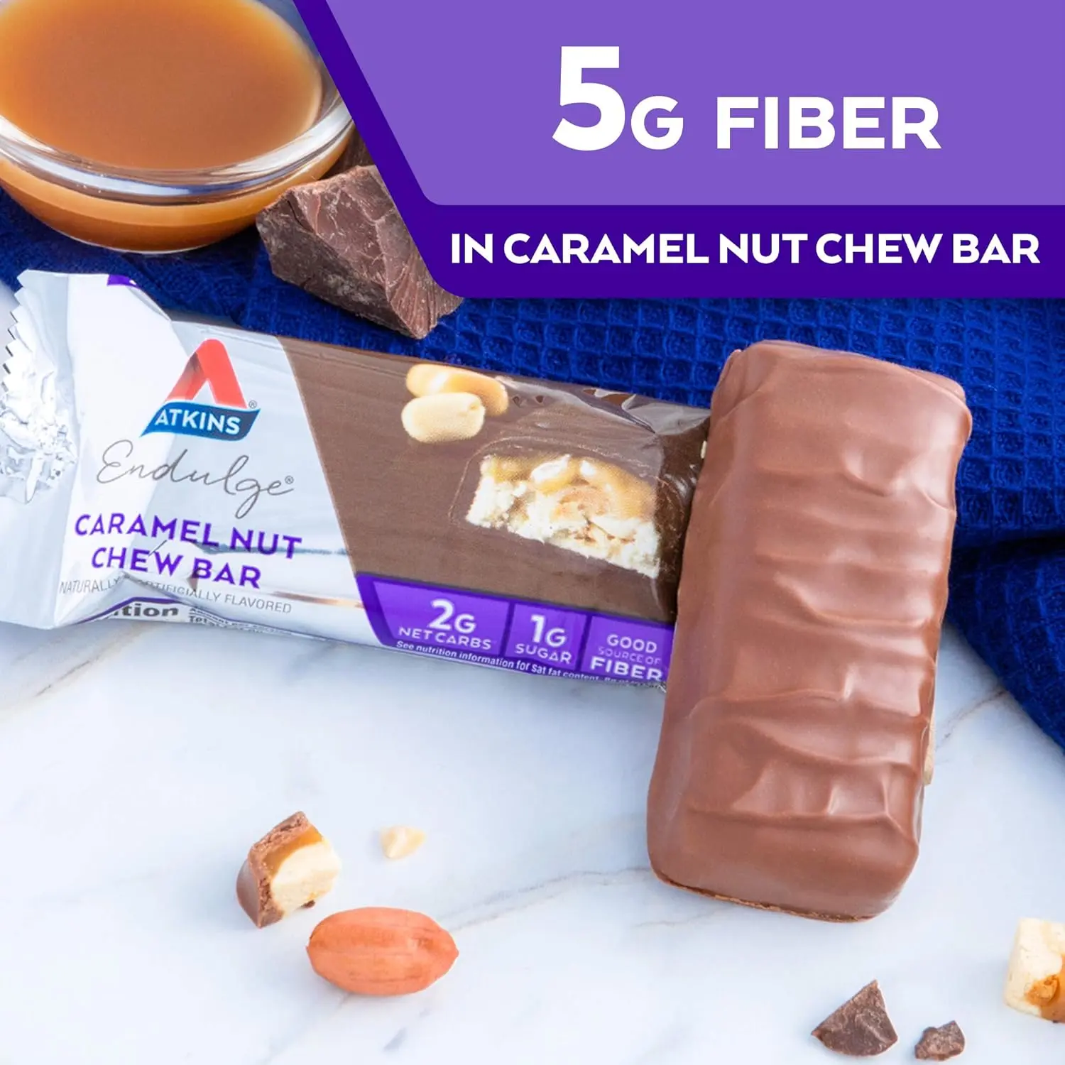 One Atkins Endulge Caramel Nut Chew bar featuring peanuts, nougat, a caramel layer, and chocolate coating, with 6 grams of fiber per serving.