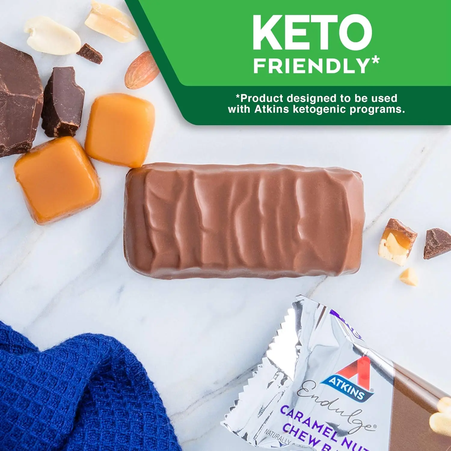 One Atkins Endulge Caramel Nut Chew bar featuring peanuts, nougat, a caramel layer, and chocolate coating, with 6 grams of fiber per serving.