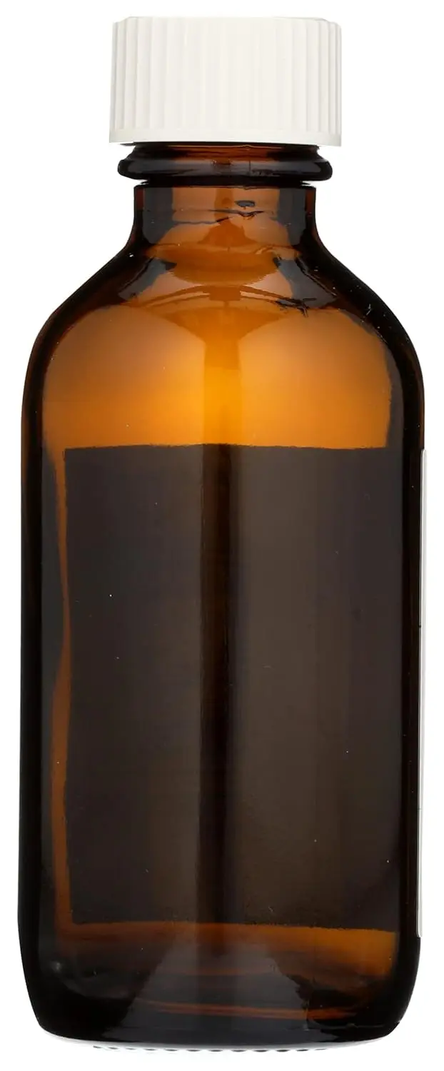 This is a 2 fl. oz. amber glass Aura Cacia bottle with a writable label, perfect for storing homemade body care products.