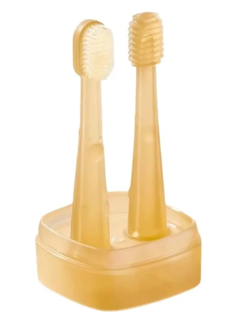 This baby toothbrush and tongue cleaner set includes a soft silicone toothbrush, tongue brush, and travel case for gentle oral care for infants 0-18 months.