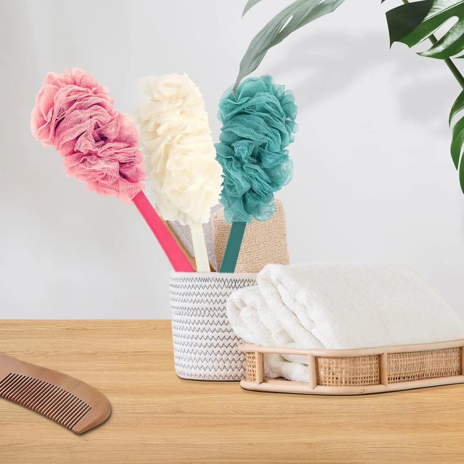 This image shows a 2-pack of blue back scrubbers with long handles and built-in loofah sponges, designed for exfoliating and cleansing hard-to-reach areas in the shower.