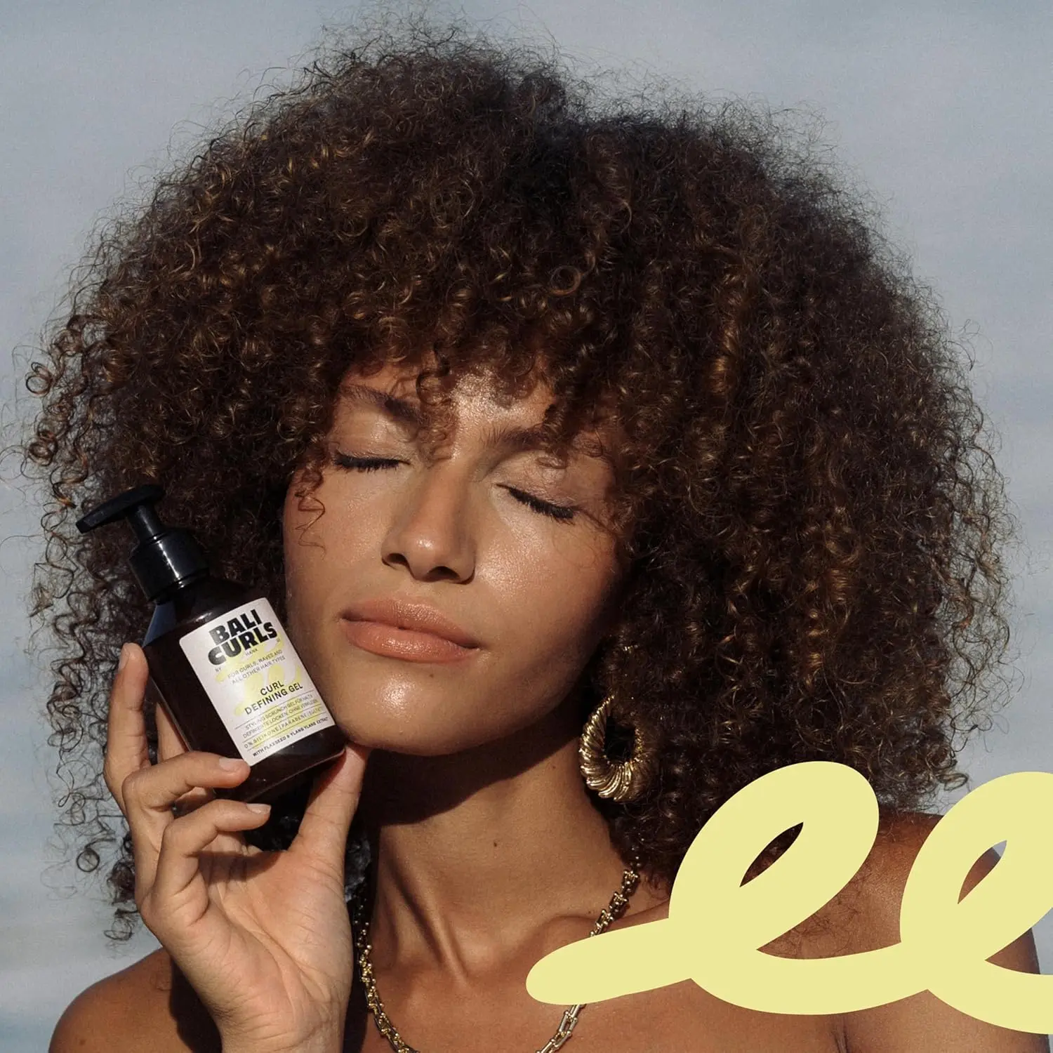 The Bali Curls Curl Defining Set, including hydrating cream and defining gel, provides moisture, definition, and flexible hold for smooth, naturally shiny curls.