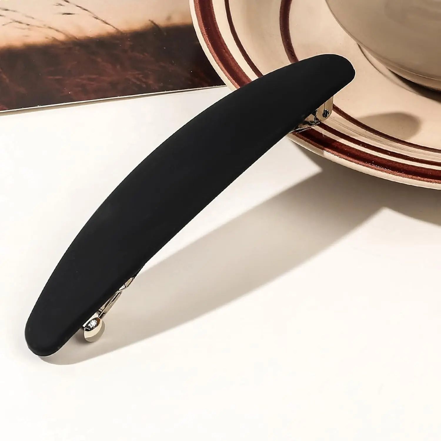 These non-slip banana hair clips in a retro and simple solid color with a unique round shape and frosted matte surface are perfect for creating a half-updo and securely holding thick or thin hair during daily commutes, parties, or night care, while being lightweight and easy to carry.